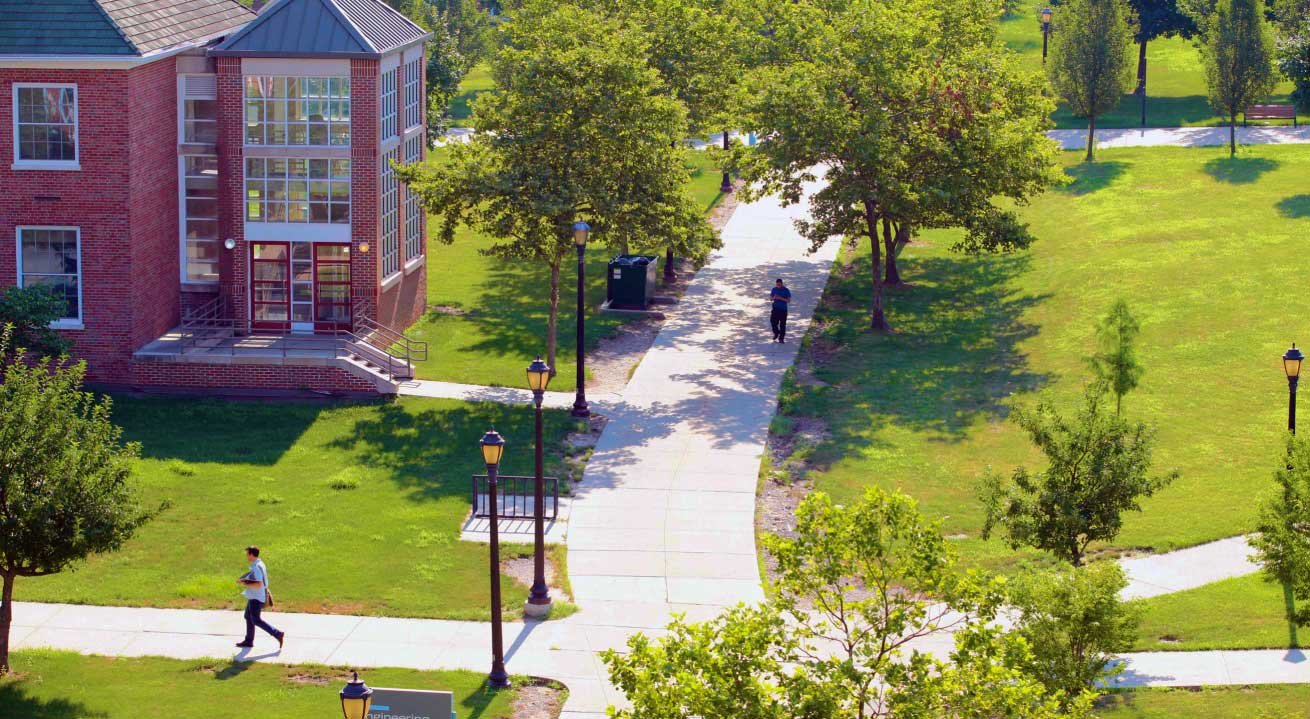 aerial view of green lawns and sidewalks on campus