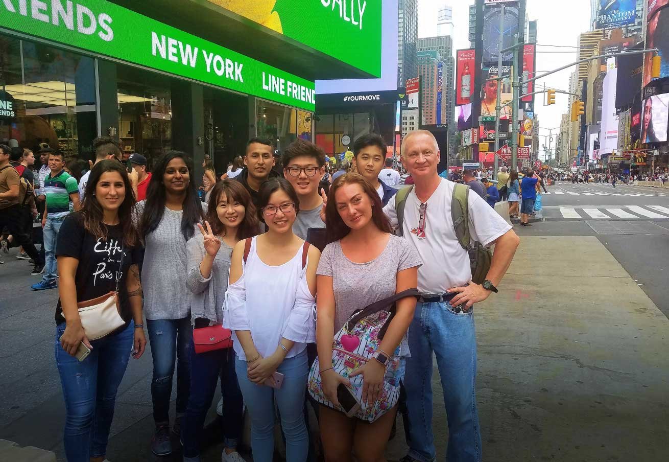 a smiling diverse group of students in New York City